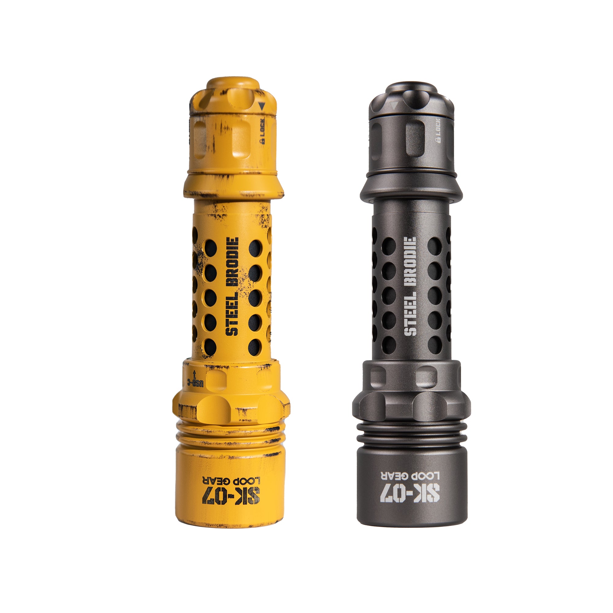 Two Steel Brode SK-07 Loop Gears shown side by side on a plain white background, one in yellow with black distressing and one in dark gray metallic finish.